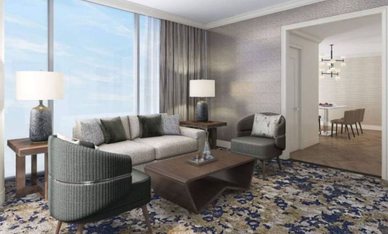 Spacious king room with lounge area at Hilton BNA Nashville Airport Terminal.