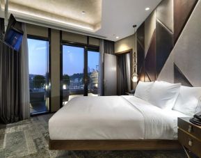Stunning king suite with large windows at DoubleTree By Hilton Istanbul - Piyalepasa.