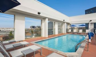 Outdoor pool with loungers at Hilton Garden Inn Nashville West End Avenue.