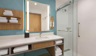 Guest bathroom with shower at Hilton Garden Inn Nashville West End Avenue.