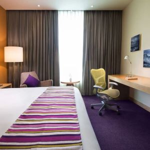 Spacious king room with natural light at Hilton Garden Inn Monterrey Airport, Nuevo Leon, Mexico.