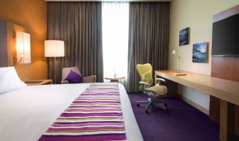 Spacious king room with natural light at Hilton Garden Inn Monterrey Airport, Nuevo Leon, Mexico.