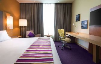 Spacious king room with natural light at Hilton Garden Inn Monterrey Airport, Nuevo Leon, Mexico.