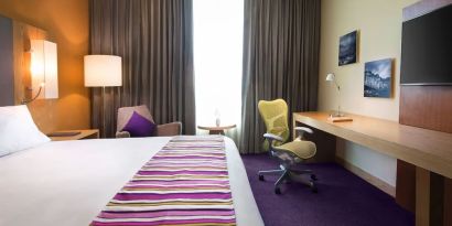 Spacious king room with natural light at Hilton Garden Inn Monterrey Airport, Nuevo Leon, Mexico.