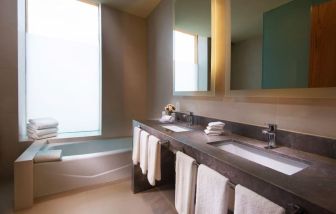 Guest bathroom with bath at Hilton Garden Inn Monterrey Airport, Nuevo Leon, Mexico.