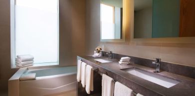 Guest bathroom with bath at Hilton Garden Inn Monterrey Airport, Nuevo Leon, Mexico.