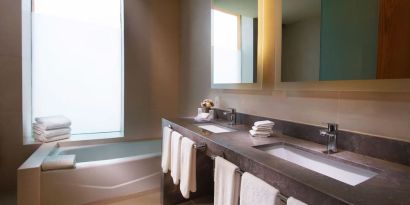 Guest bathroom with bath at Hilton Garden Inn Monterrey Airport, Nuevo Leon, Mexico.