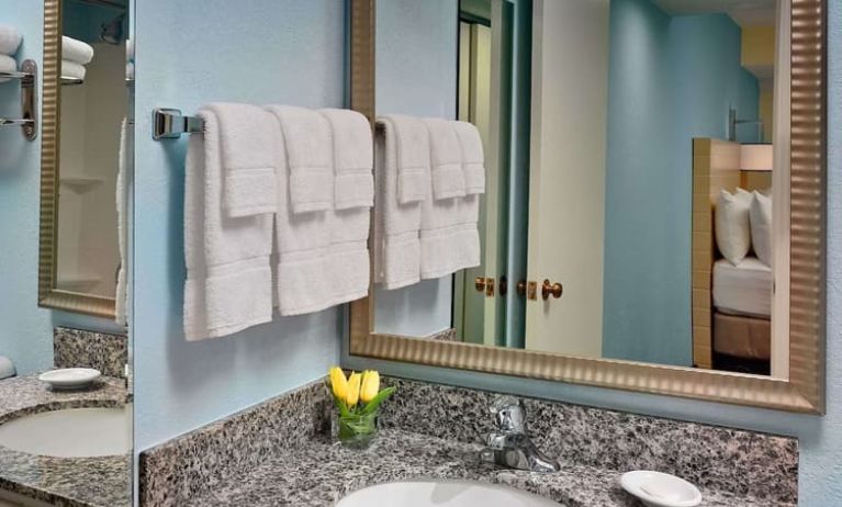 Sonesta ES Suites Tucson guest bathroom provides an ensuite shower and sink.