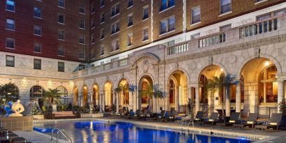 Outdoor pool at night at The Chase Park Plaza Royal Sonesta St. Louis.