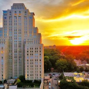 Hotel exterior at sunset at The Chase Park Plaza Royal Sonesta St. Louis.