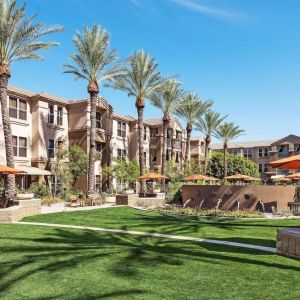 Hotel exterior with garden at Sonesta Suites Scottsdale Gainey Ranch.