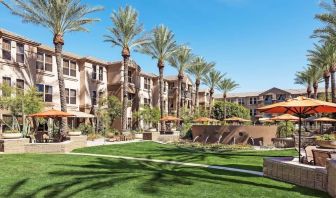 Hotel exterior with garden at Sonesta Suites Scottsdale Gainey Ranch.