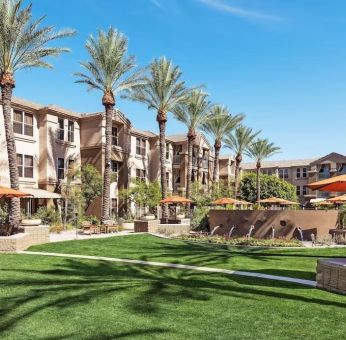 Hotel exterior with garden at Sonesta Suites Scottsdale Gainey Ranch.