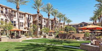 Hotel exterior with garden at Sonesta Suites Scottsdale Gainey Ranch.