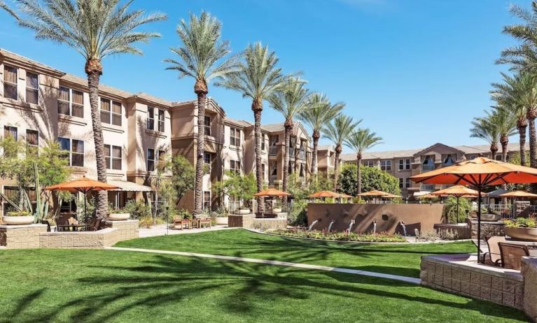 Hotel exterior with garden at Sonesta Suites Scottsdale Gainey Ranch.