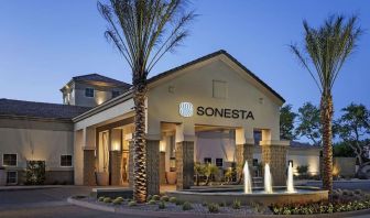 Hotel exterior and parking at Sonesta Suites Scottsdale Gainey Ranch.