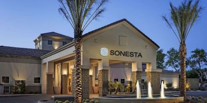 Hotel exterior and parking at Sonesta Suites Scottsdale Gainey Ranch.