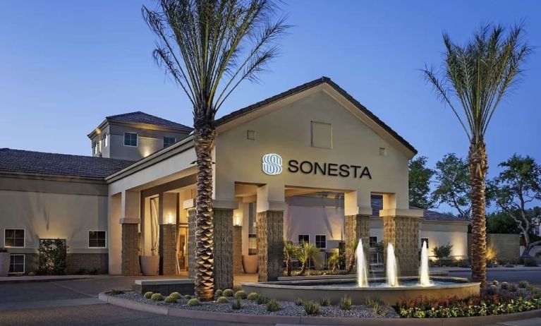 Hotel exterior and parking at Sonesta Suites Scottsdale Gainey Ranch.