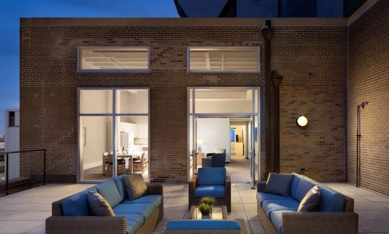 Outdoor lounge and coworking space at Sonesta ES Suites New Orleans.