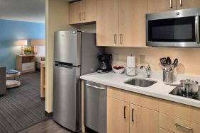 Day room with kitchen at Sonesta ES Suites New Orleans.