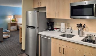 Day room with kitchen at Sonesta ES Suites New Orleans.