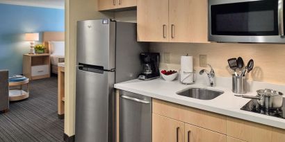 Day room with kitchen at Sonesta ES Suites New Orleans.