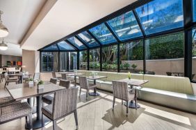 Dining area with natural light at Sonesta Los Angeles Airport LAX.