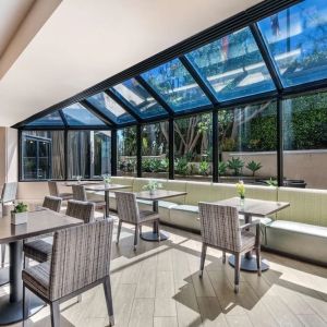 Dining area with natural light at Sonesta Los Angeles Airport LAX.