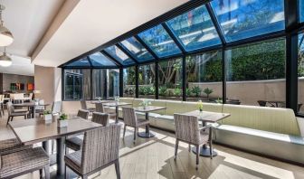 Dining area with natural light at Sonesta Los Angeles Airport LAX.