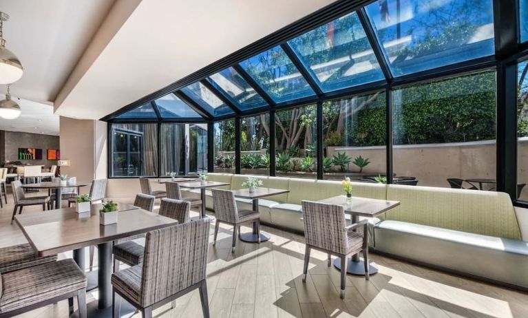 Dining area with natural light at Sonesta Los Angeles Airport LAX.