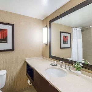 Guest bathroom with shower at Sonesta Los Angeles Airport LAX.