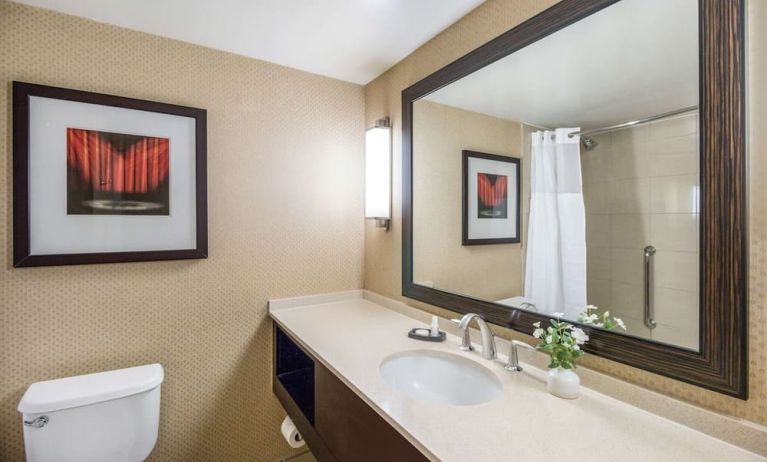 Guest bathroom with shower at Sonesta Los Angeles Airport LAX.