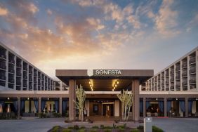 Parking and hotel exterior at Sonesta Redondo Beach & Marina.