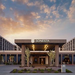 Parking and hotel exterior at Sonesta Redondo Beach & Marina.