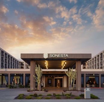 Parking and hotel exterior at Sonesta Redondo Beach & Marina.