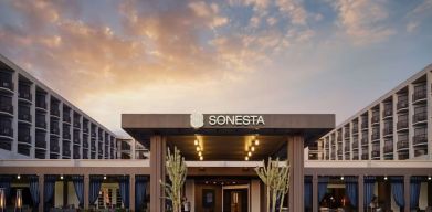 Parking and hotel exterior at Sonesta Redondo Beach & Marina.