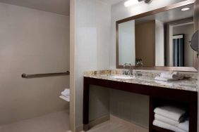 Guest bathroom with shower at Sonesta Redondo Beach & Marina.