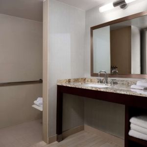 Guest bathroom with shower at Sonesta Redondo Beach & Marina.