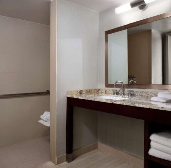 Guest bathroom with shower at Sonesta Redondo Beach & Marina.