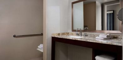 Guest bathroom with shower at Sonesta Redondo Beach & Marina.