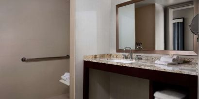 Guest bathroom with shower at Sonesta Redondo Beach & Marina.