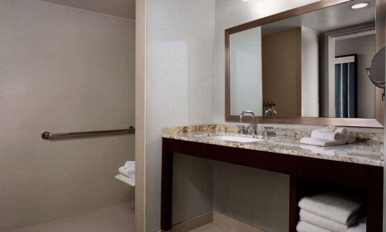 Guest bathroom with shower at Sonesta Redondo Beach & Marina.