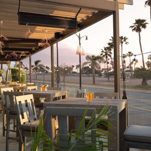 Outdoor eating area at Sonesta Redondo Beach & Marina.