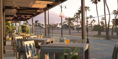 Outdoor eating area at Sonesta Redondo Beach & Marina.