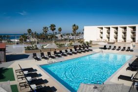 Lovely outdoor pool and pool chairs at Sonesta Redondo Beach & Marina.