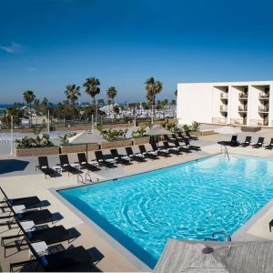 Lovely outdoor pool and pool chairs at Sonesta Redondo Beach & Marina.