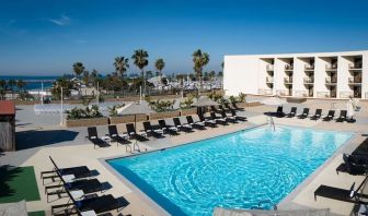 Lovely outdoor pool and pool chairs at Sonesta Redondo Beach & Marina.