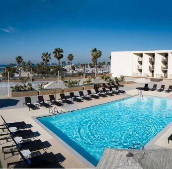 Lovely outdoor pool and pool chairs at Sonesta Redondo Beach & Marina.