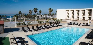 Lovely outdoor pool and pool chairs at Sonesta Redondo Beach & Marina.