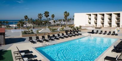 Lovely outdoor pool and pool chairs at Sonesta Redondo Beach & Marina.